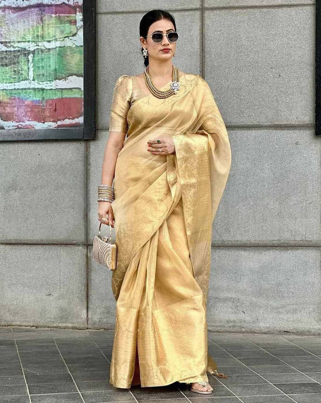 Elegant Embroidered Gota Tissue Saree Canada in gold worn with stylish accessories