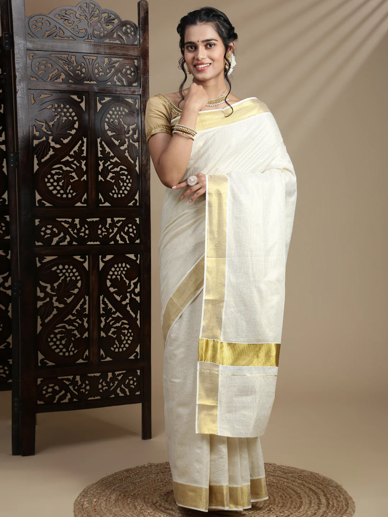 Elegant white embroidered Gota tissue saree with golden accents, perfect for weddings in Canada