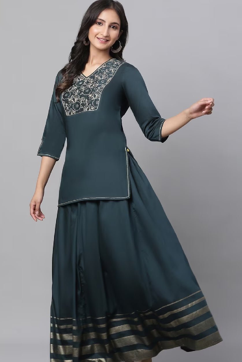 Aromie embroidered Kurta set for women featuring a teal kurta with intricate embroidery and matching skirt