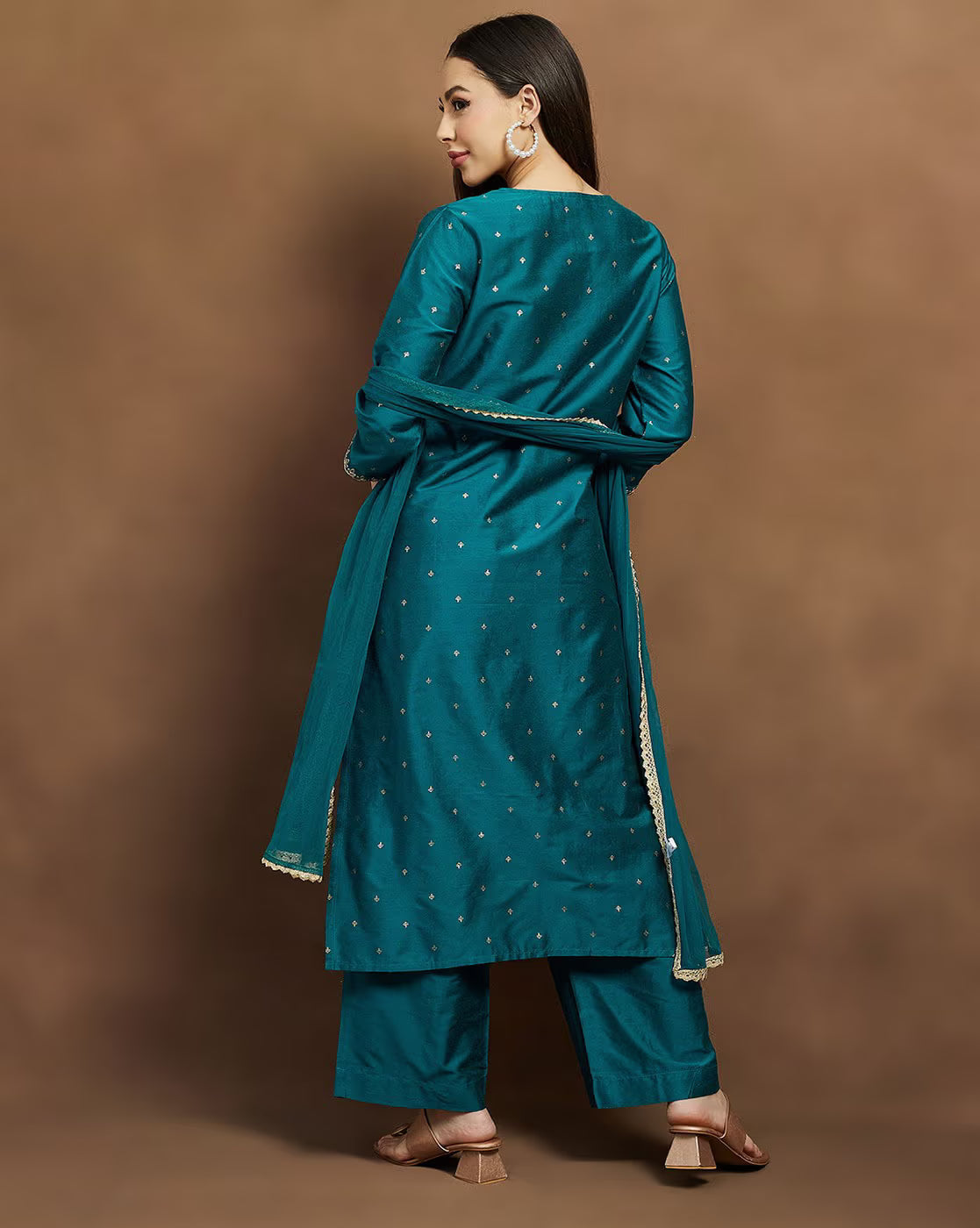 Embroidered kurta suit set for women in teal with matching pants and dupatta, styled elegantly for festive occasions