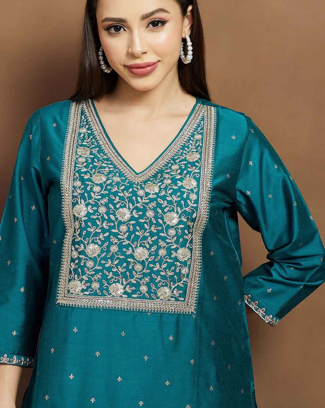 Elegant embroidered kurta suit set for women in teal with intricate floral designs