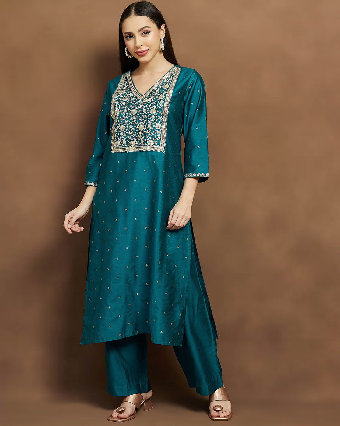 Teal embroidered kurta suit set for women featuring intricate designs and comfortable fit