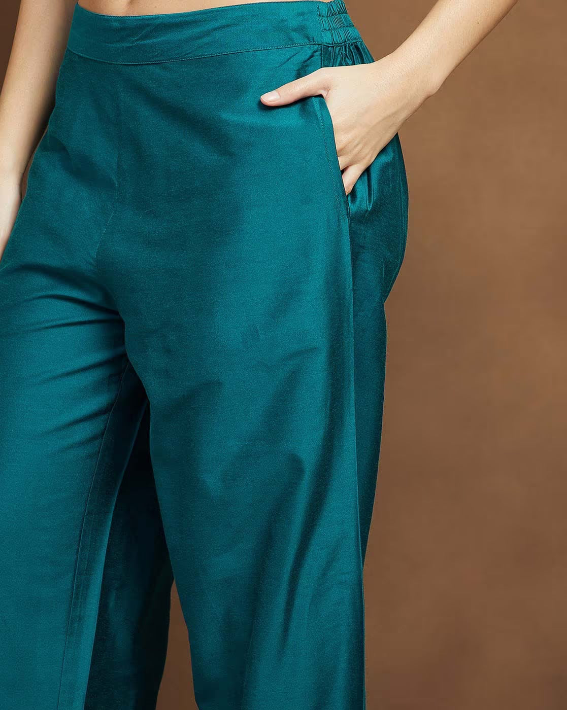 Teal green palazzo pants with side pockets from AROMIE, part of embroidered kurta suit set for women