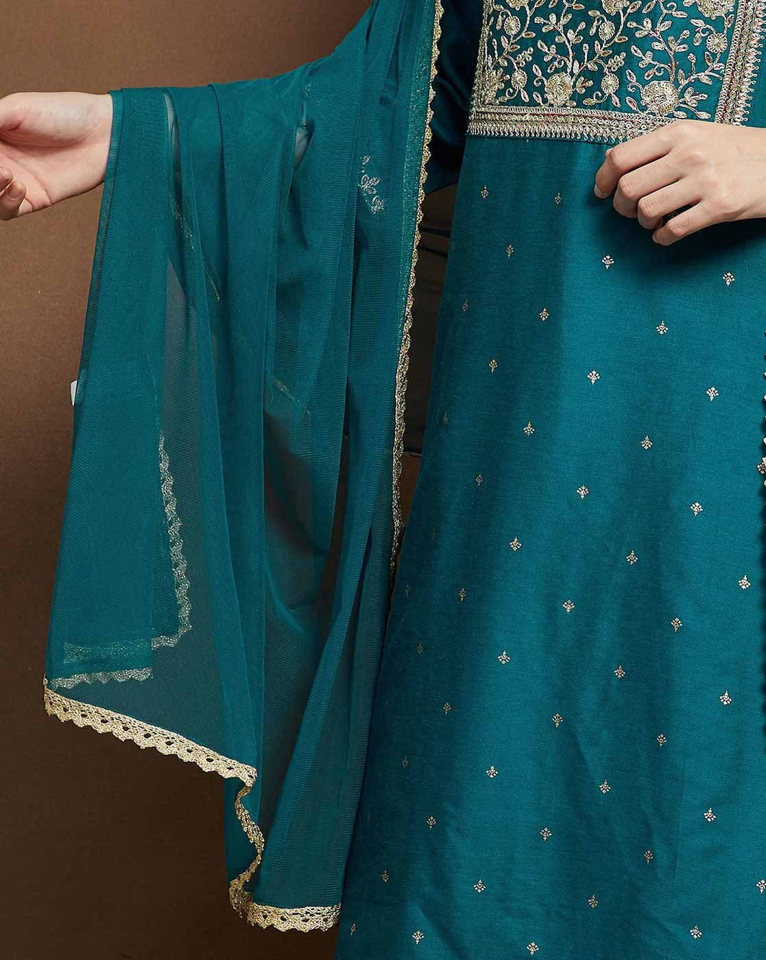Teal embroidered kurta suit set for women featuring intricate designs and flowing sleeves