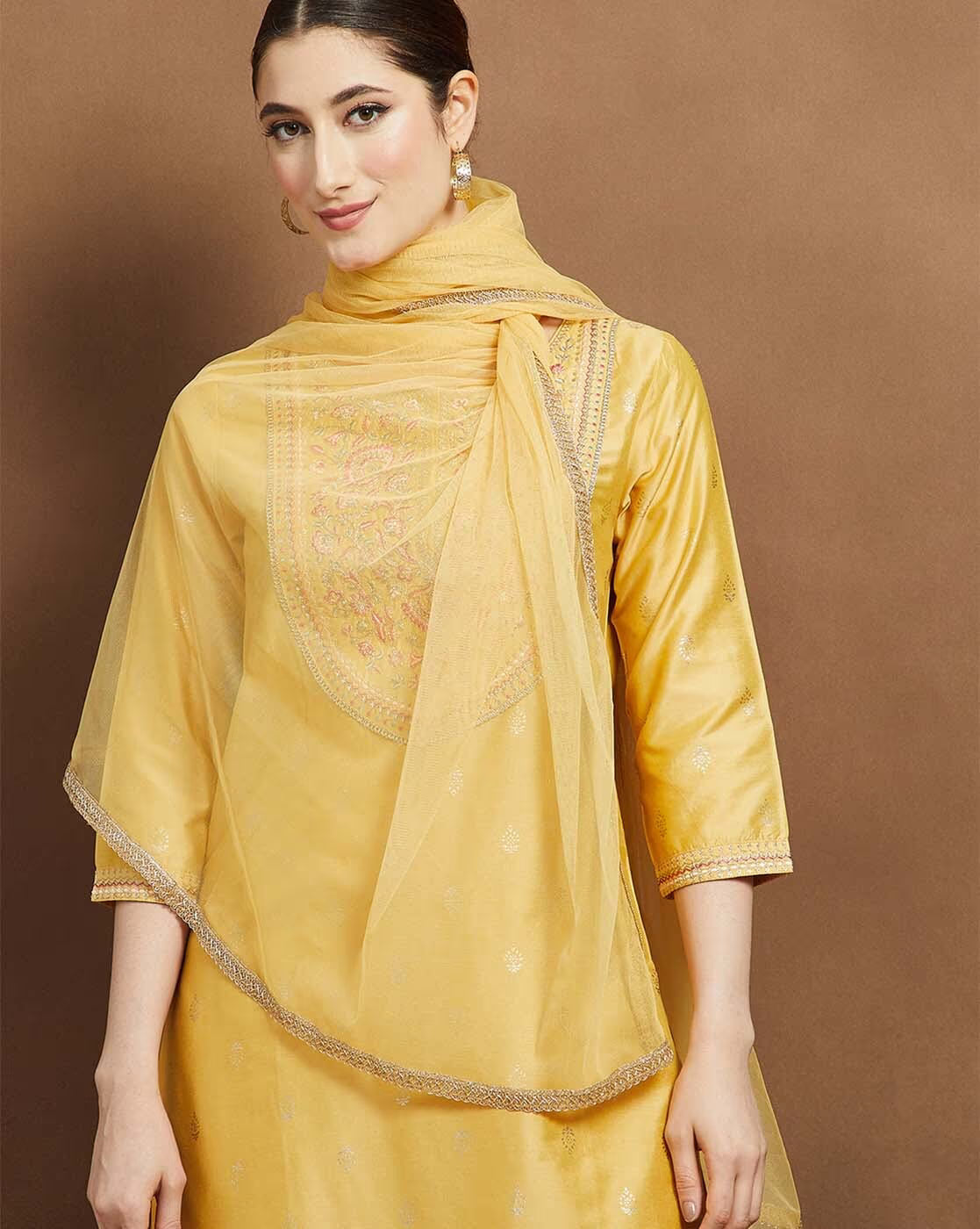 Elegant yellow embroidered kurta suit set for women with intricate design and lightweight scarf