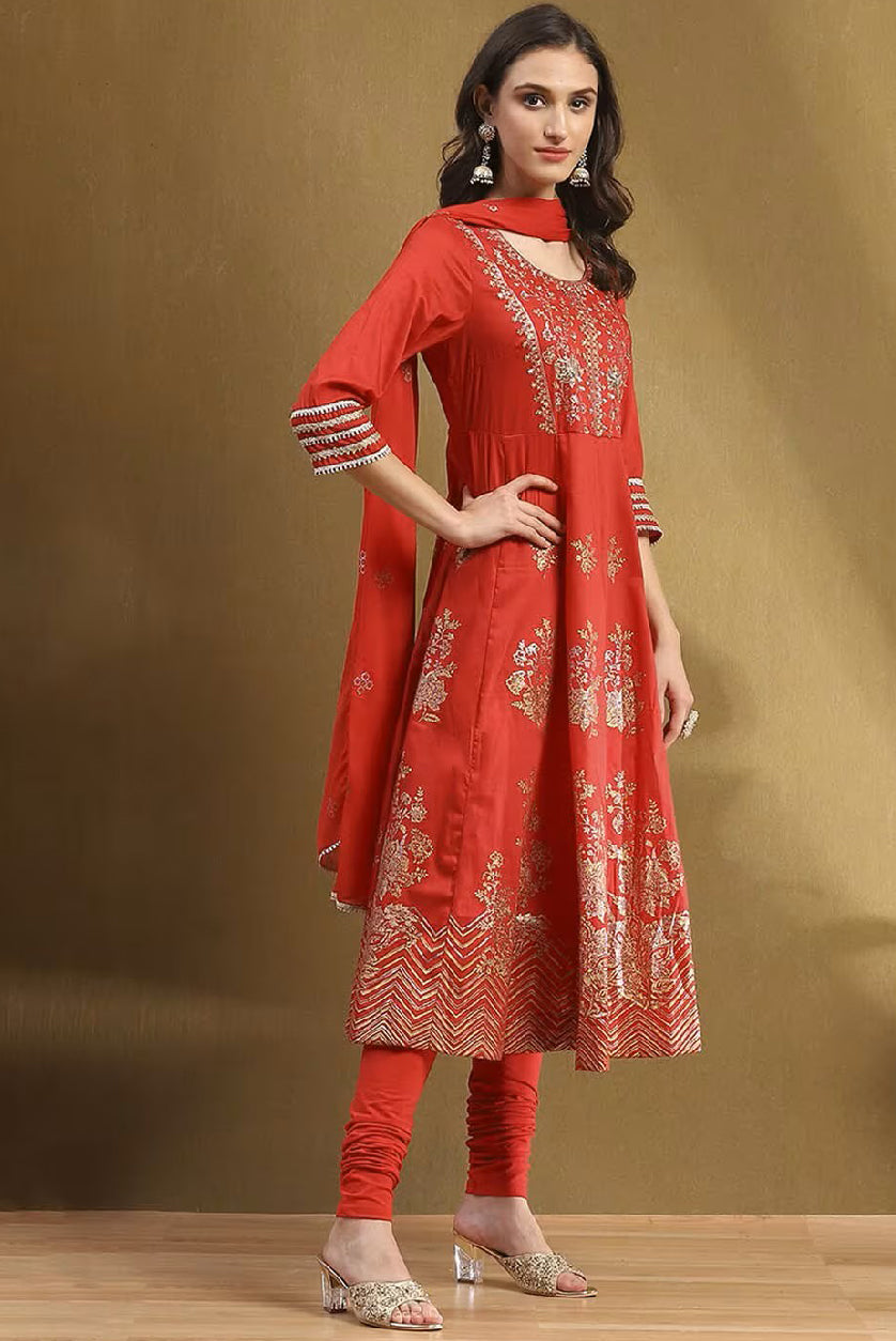 Aromie Embroidered Kurta Suit Set in vibrant red with intricate gold embroidery and matching accessories