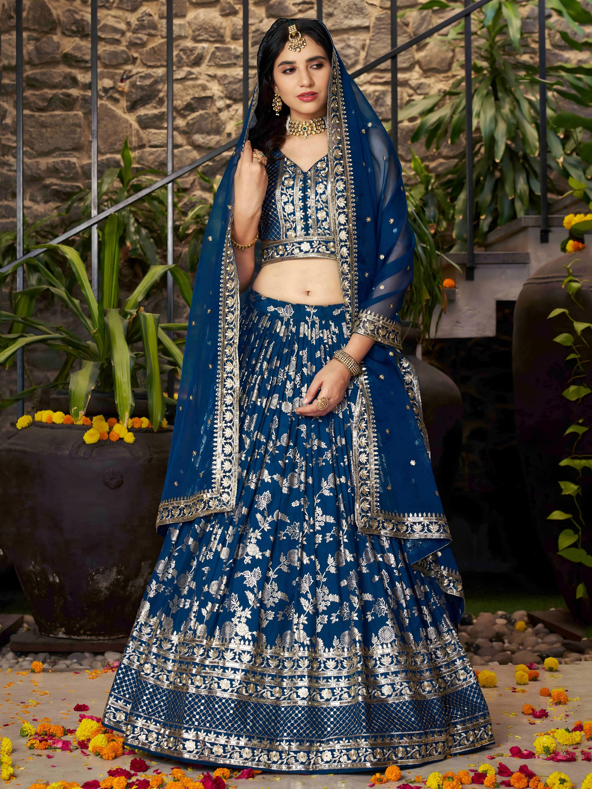 Front view of a blue embroidered lehenga choli set Canada with floral patterns, ideal for weddings and festive occasions.
