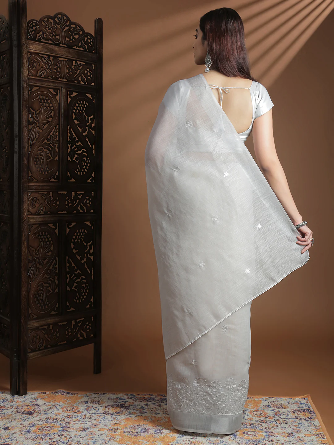 Silver embroidered Saree in lightweight fabric, perfect for weddings and festive occasions, shown from the back.