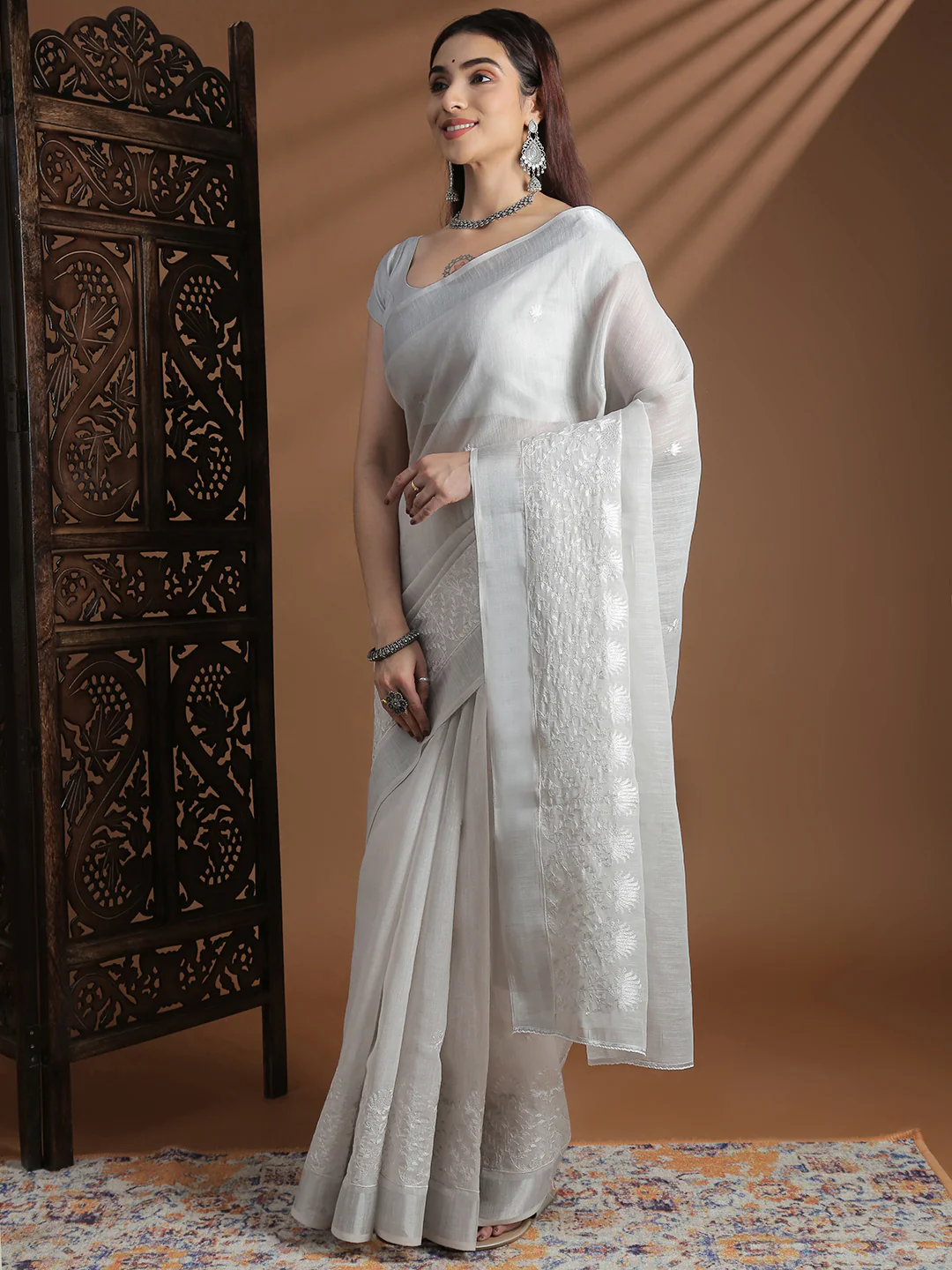 Elegant embroidered Saree in white with intricate detailing, perfect for weddings and festive occasions