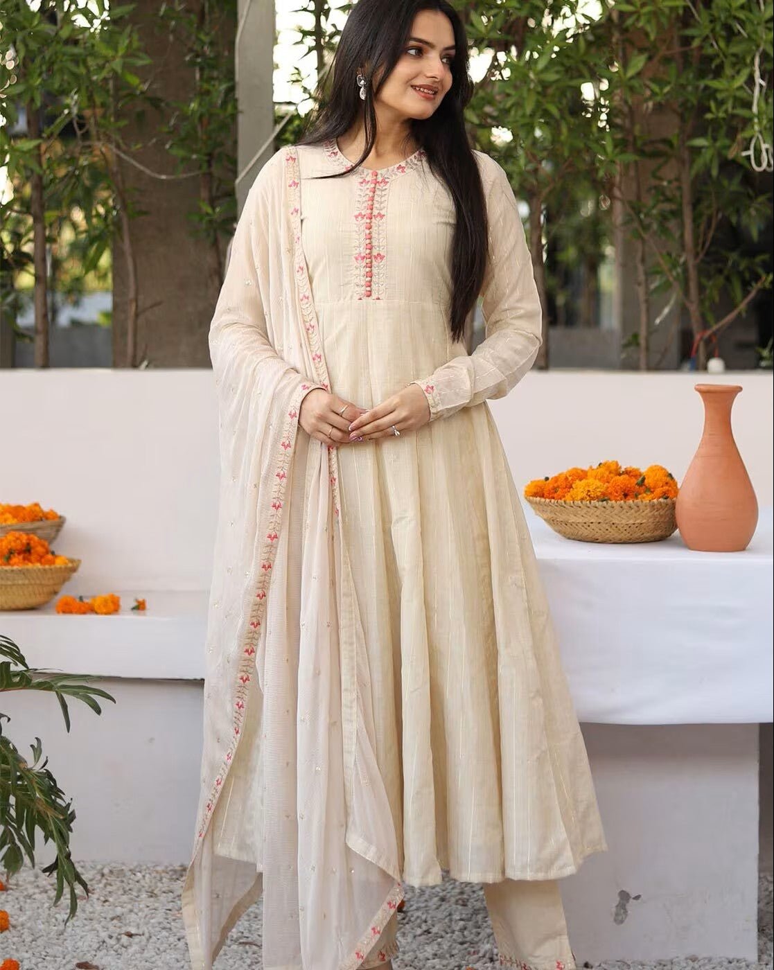 Elegant Embroidered Silk Anarkali Kurta Set in cream with intricate floral designs and matching dupatta