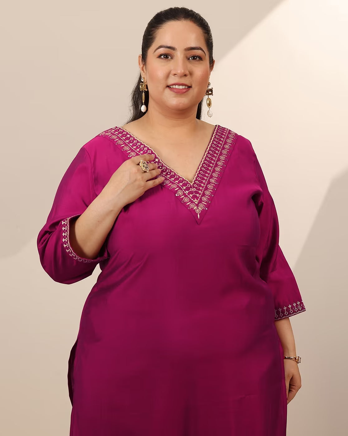Embroidered straight kurta set for women in vibrant pink with elegant detailing and a stylish V-neck