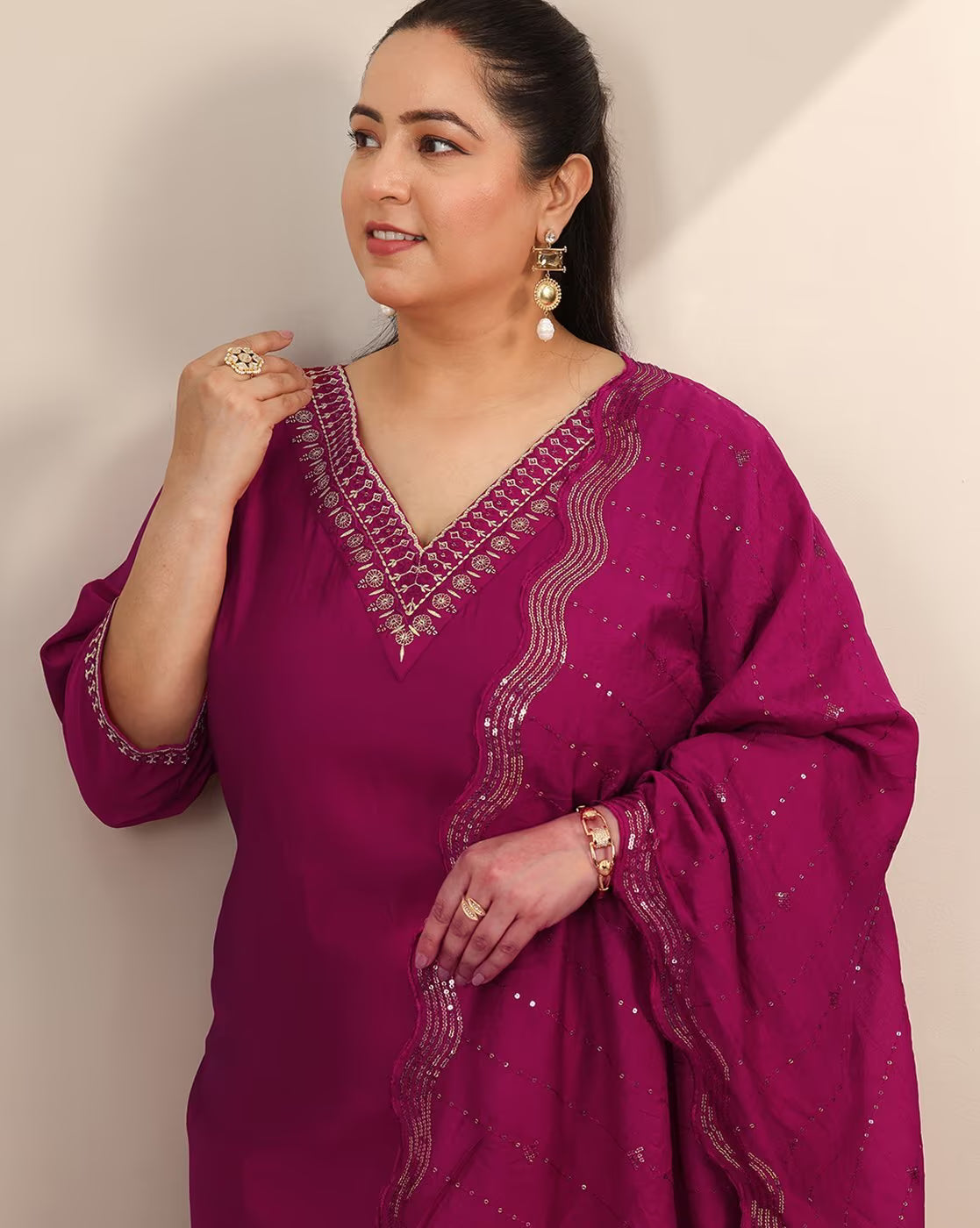 Elegant embroidered straight kurta set for women in vibrant pink with intricate detailing and flowy sleeves
