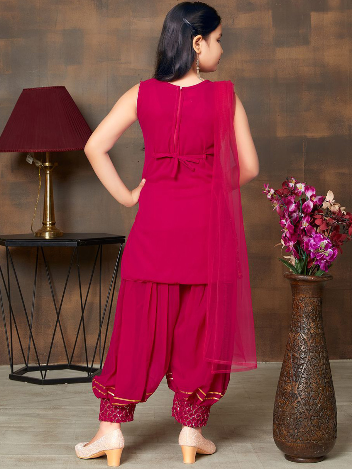 Back view of Aromie Girls Ethnic Kurta Set in fuchsia with embroidered palazzo pants, perfect for weddings in the USA