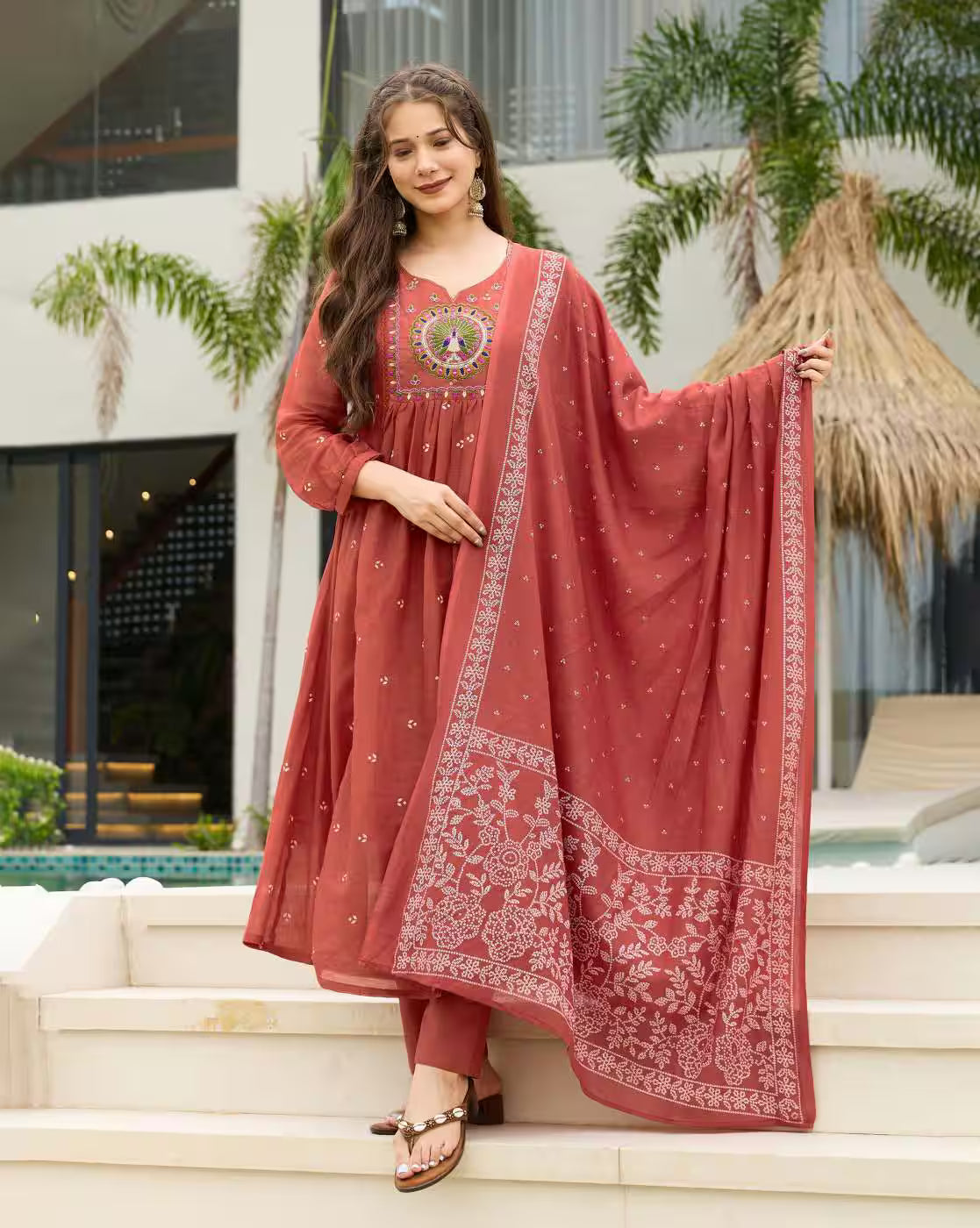 Aromie three piece Kurtha in rust with embroidered yoke matching pants and printed dupatta Floral Rayon Kurta Set