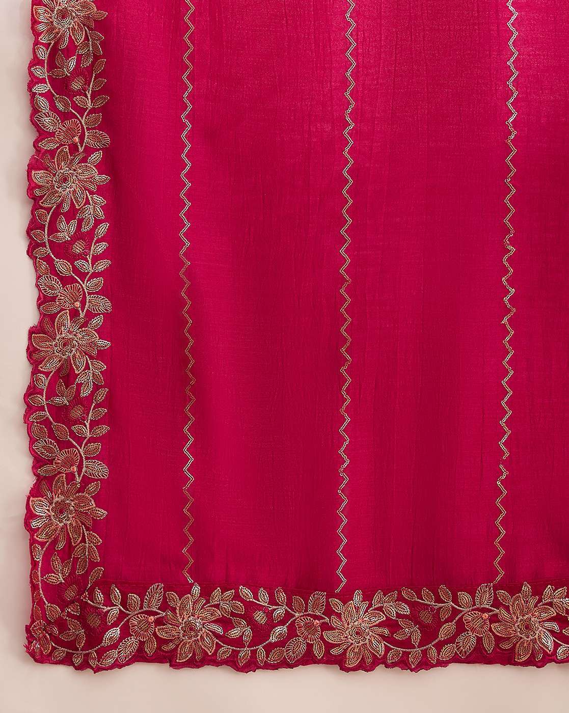 Aromie three piece kurtha magenta fabric close up showing gold floral border embroidery and trim elegant white kurta set