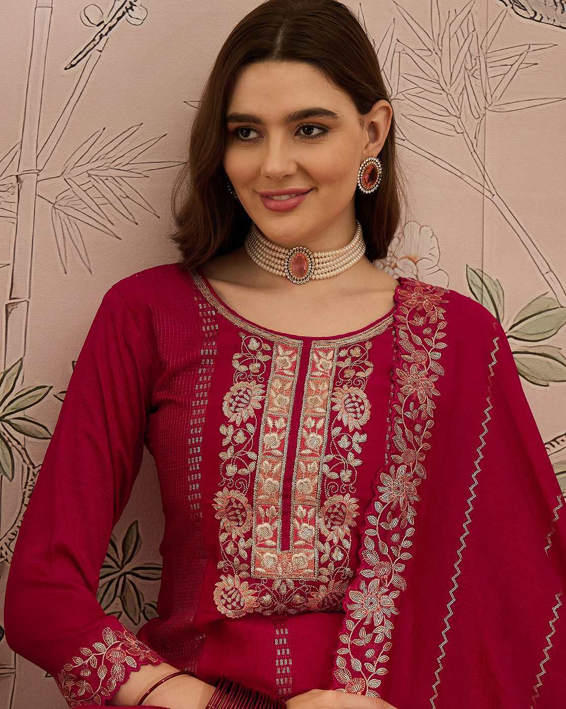 Aromie three piece elegant white kurta set shown on model wearing maroon embroidered kurta and dupatta