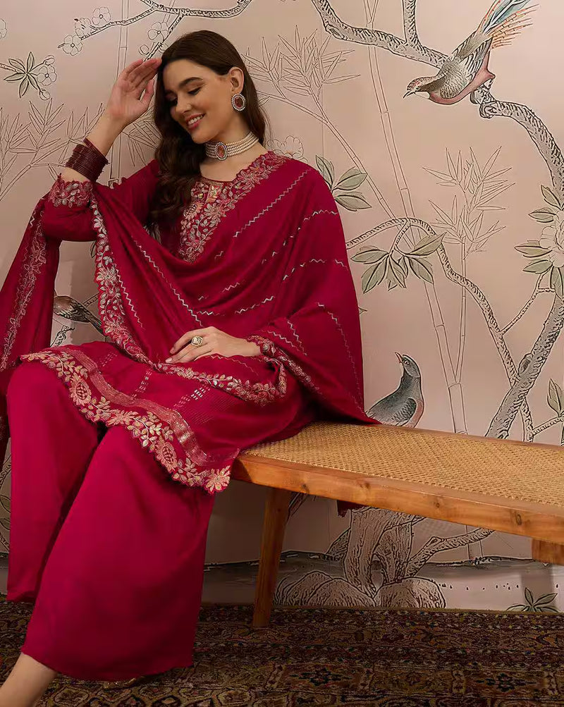Aromie three piece kurtha set deep red embroidered on model sitting on bench elegant white kurta set
