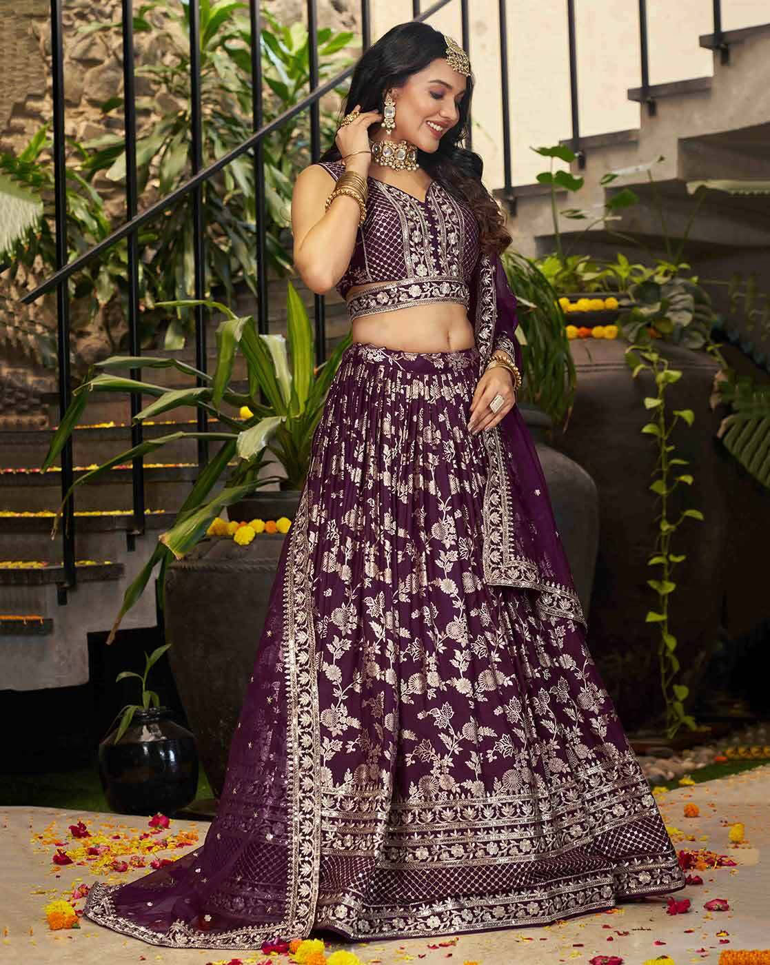 Model wearing purple embroidered lehenga choli set Canada with intricate silver floral embroidery and matching dupatta