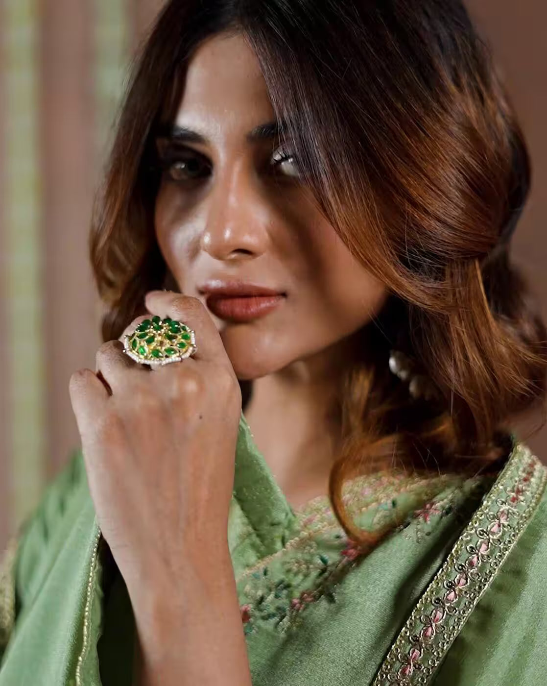 Aromie three piece kurtha close up of woman in green embroidered outfit wearing statement green ring Festive kurta set for women