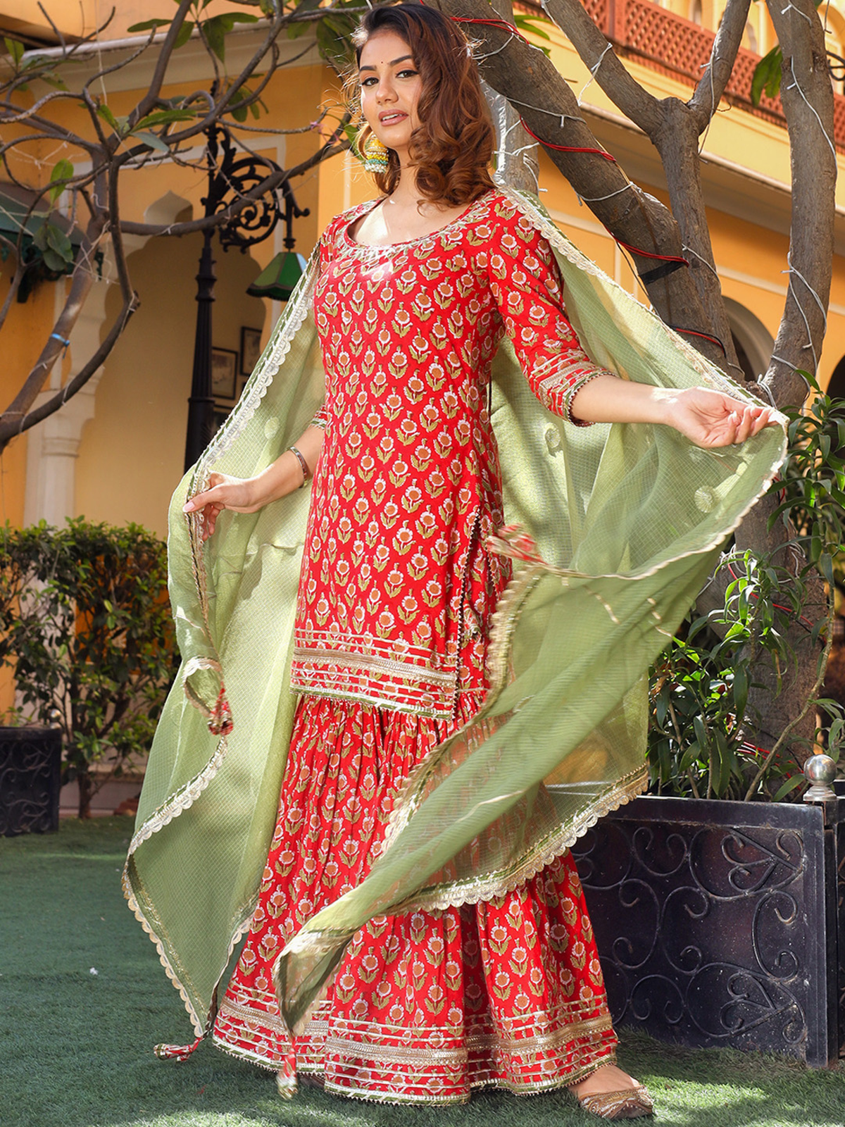 Aromie three piece Rayon Anarkali Kurta Set in red with gold print and green dupatta full length ethnic wear