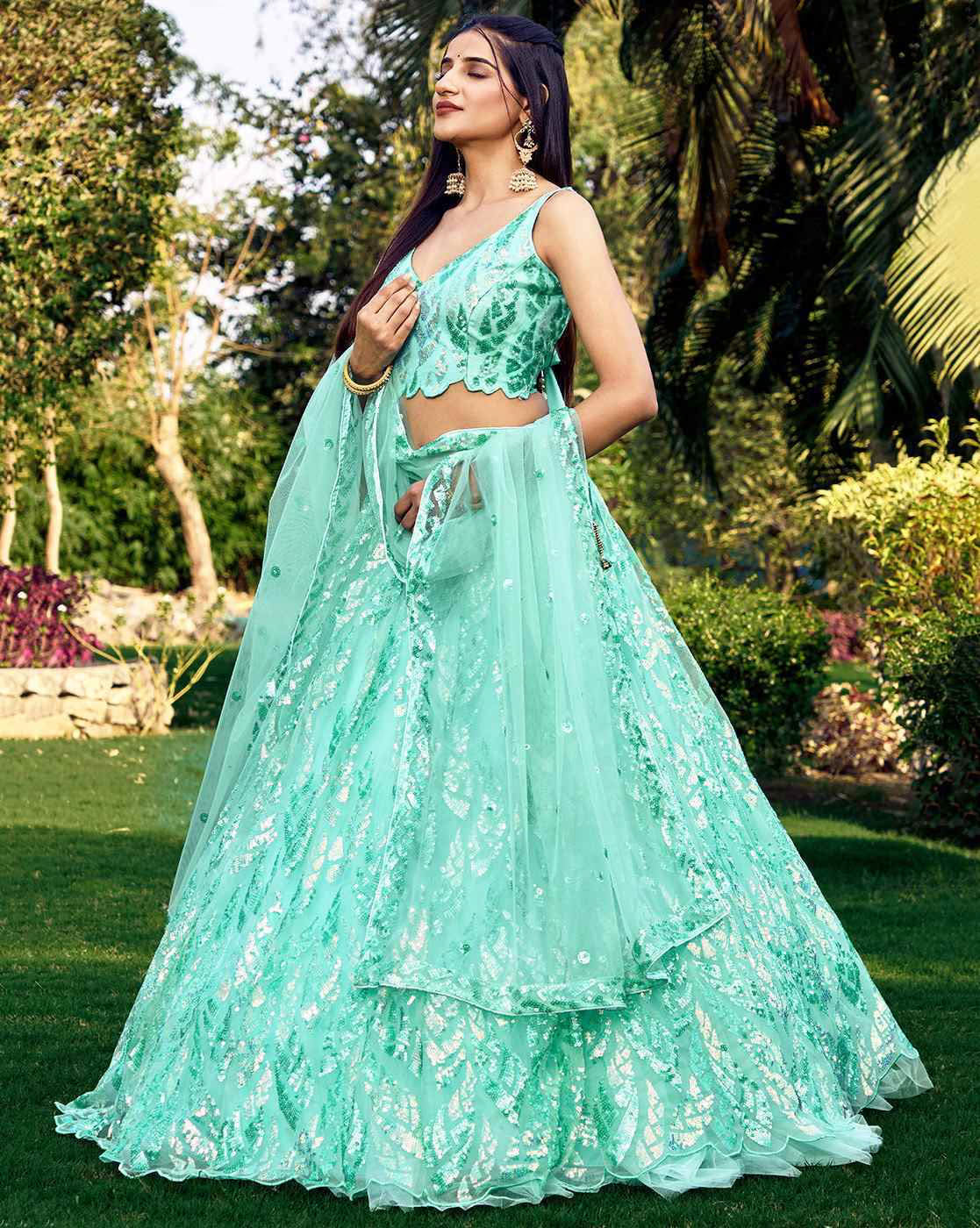 Mint green women embellished lehenga choli set with sequin embroidery and sheer dupatta in garden
