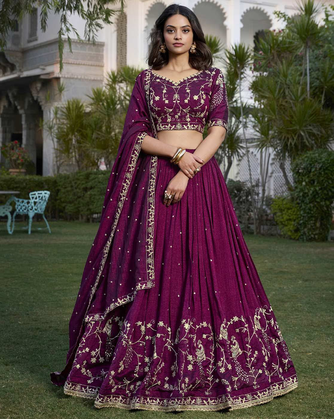 Deep magenta silk women's embroidered lehenga choli set with gold floral embroidery and matching dupatta