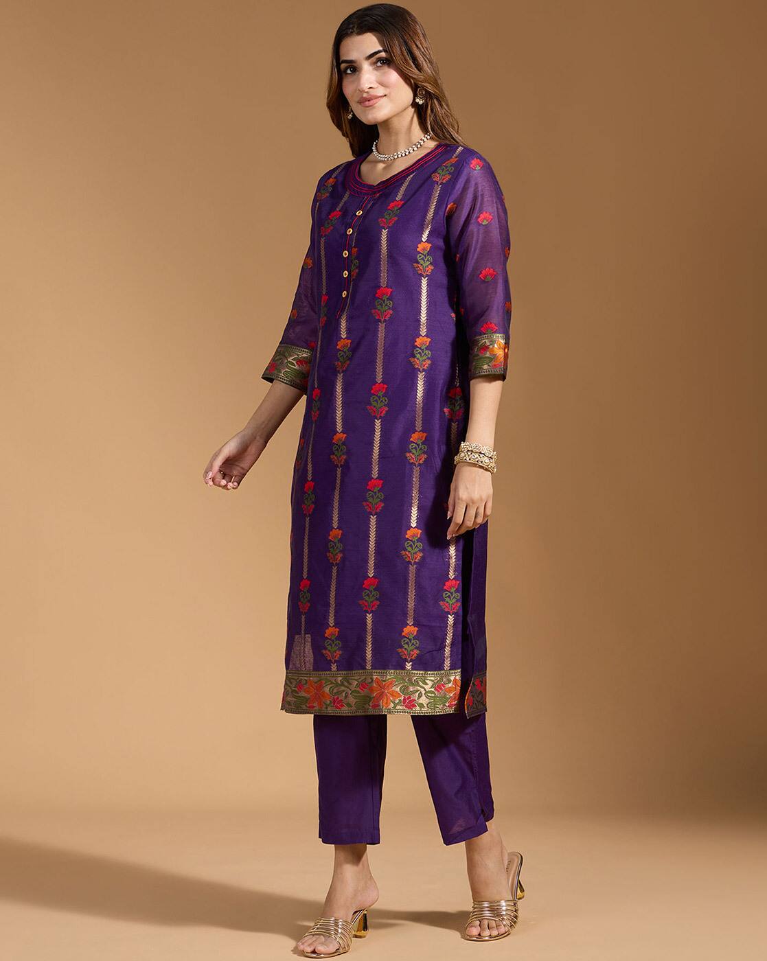 Aromie three piece teal floral kurta set in purple fabric with vertical floral motifs and gold green border