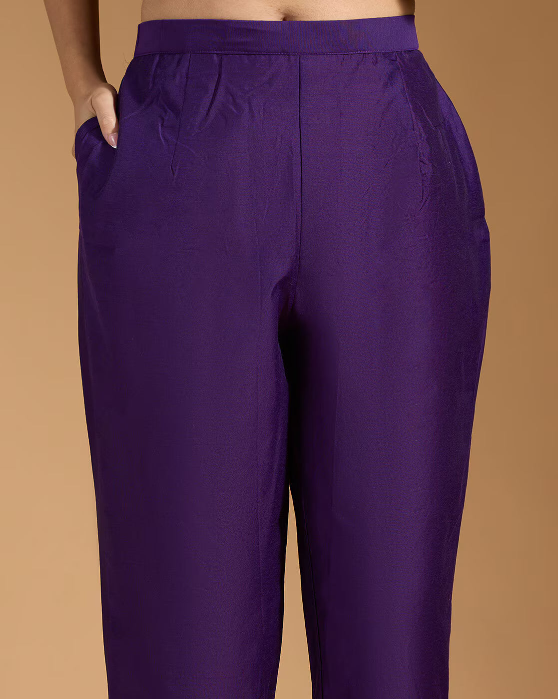 Aromie three piece teal floral kurta set showing purple tapered pants with pockets and fitted waistband