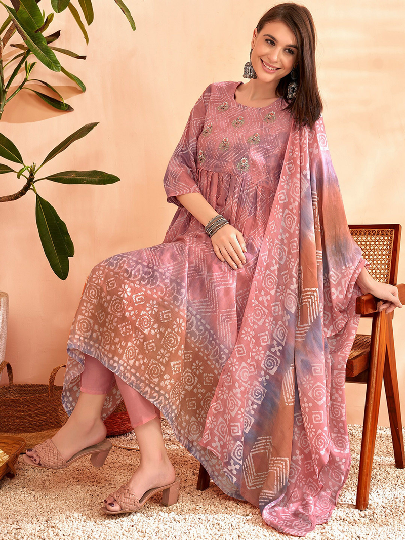 Aromie three piece kurtha set with White Cotton Chikankari Palazzo paired with printed pink kurta and dupatta model seated