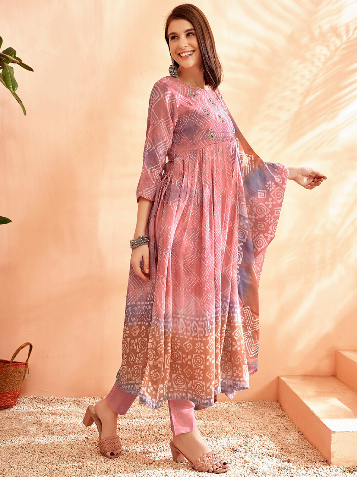 Aromie three piece kurtha with flowing printed anarkali kurta and White Cotton Chikankari Palazzo pants in soft pink tones