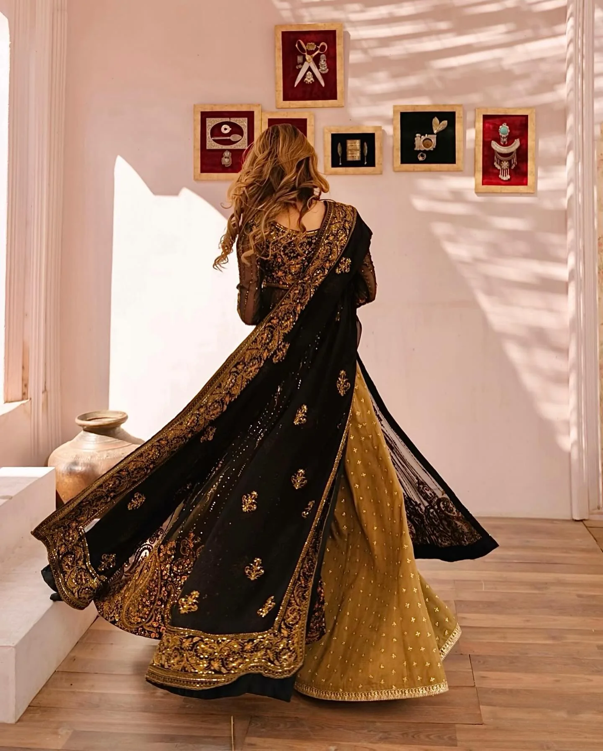 Elegant three piece Kurtha in black and gold faux georgette palazzo set with dupatta, ideal for festive occasions