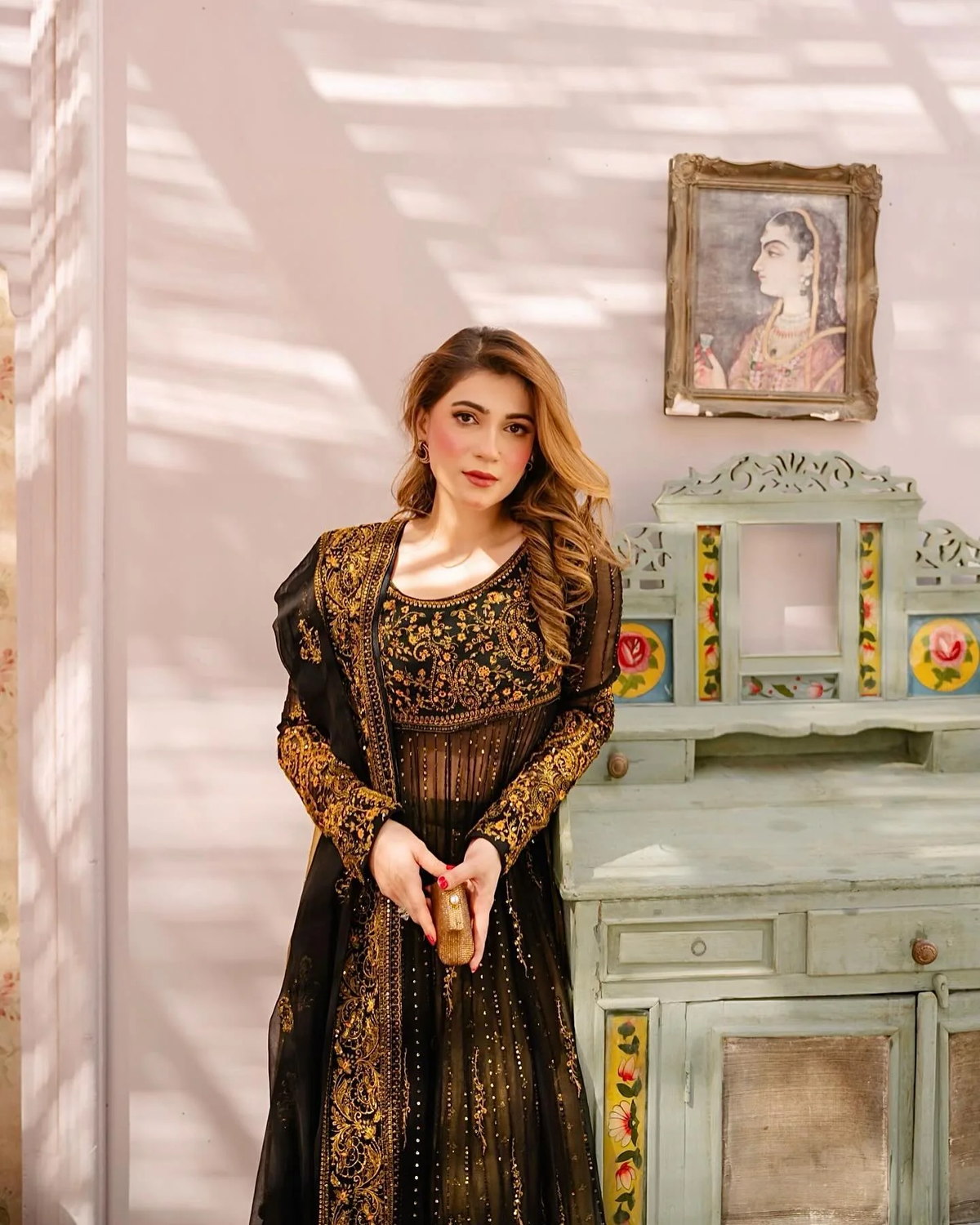 Elegant black three piece Kurtha in faux georgette with dupatta, perfect for festive occasions.