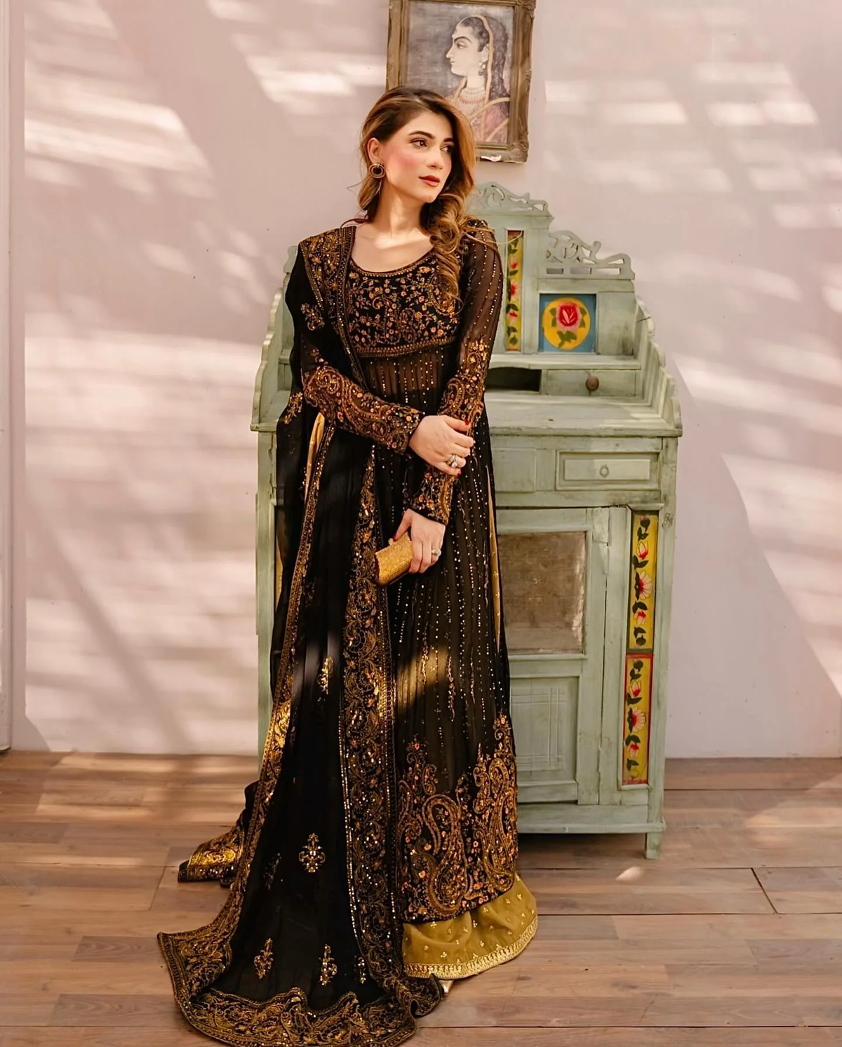 Black three piece Kurtha set in faux georgette with palazzo and dupatta, perfect for festive occasions