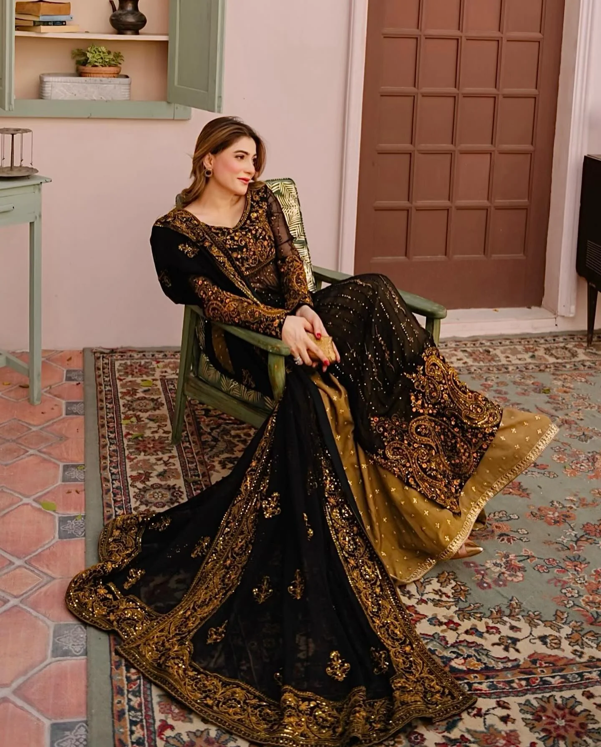 Elegant black and gold three piece Kurtha set with faux georgette palazzo set with dupatta, perfect for festive occasions.