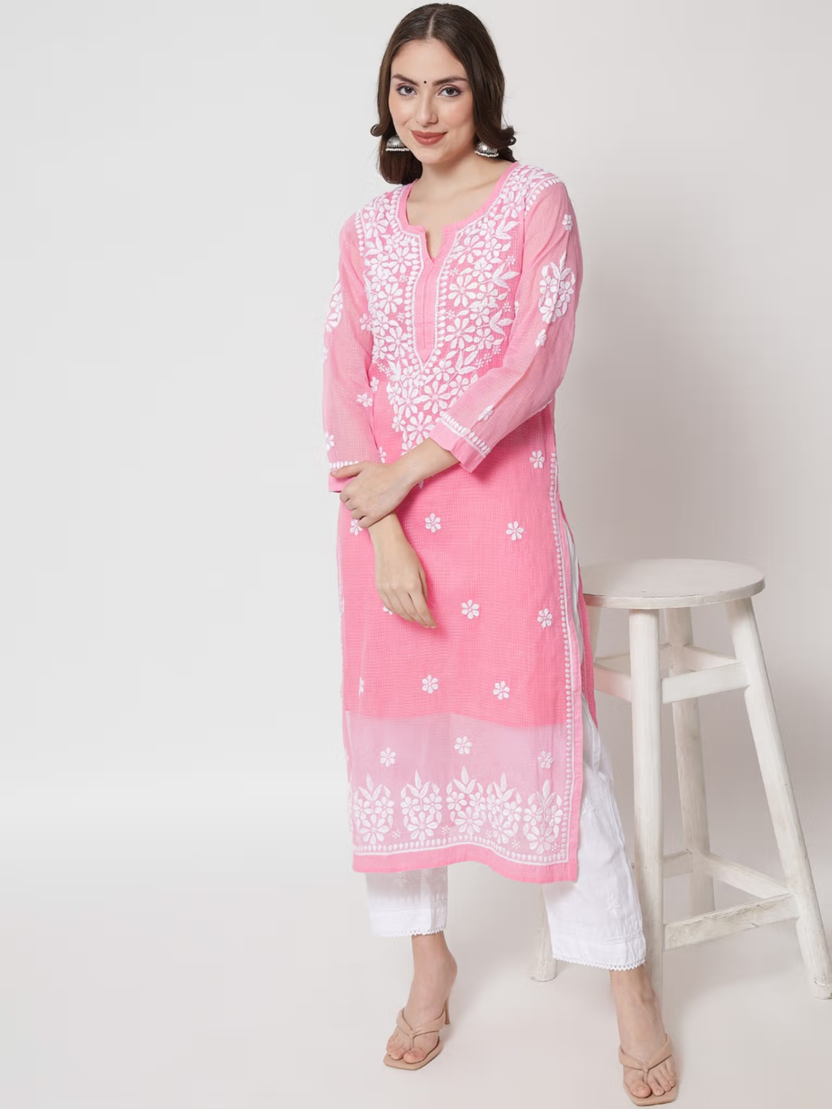 Aromie pink embroidered single piece kurta on model with white pants and sandals, tagged printed viscose jumpsuit