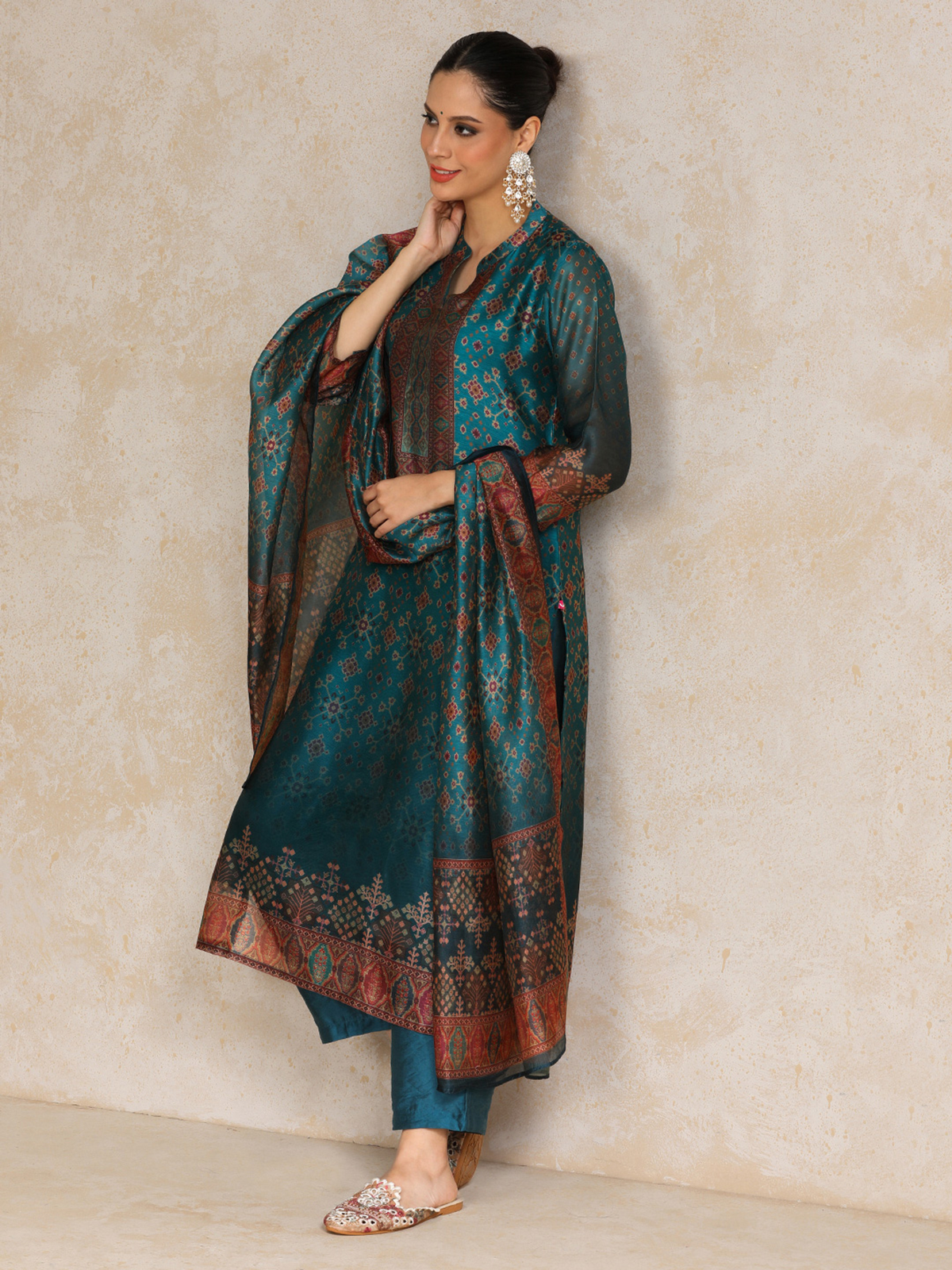 Floral Anarkali Kurta Set in teal with intricate patterns and elegant dupatta for festive occasions