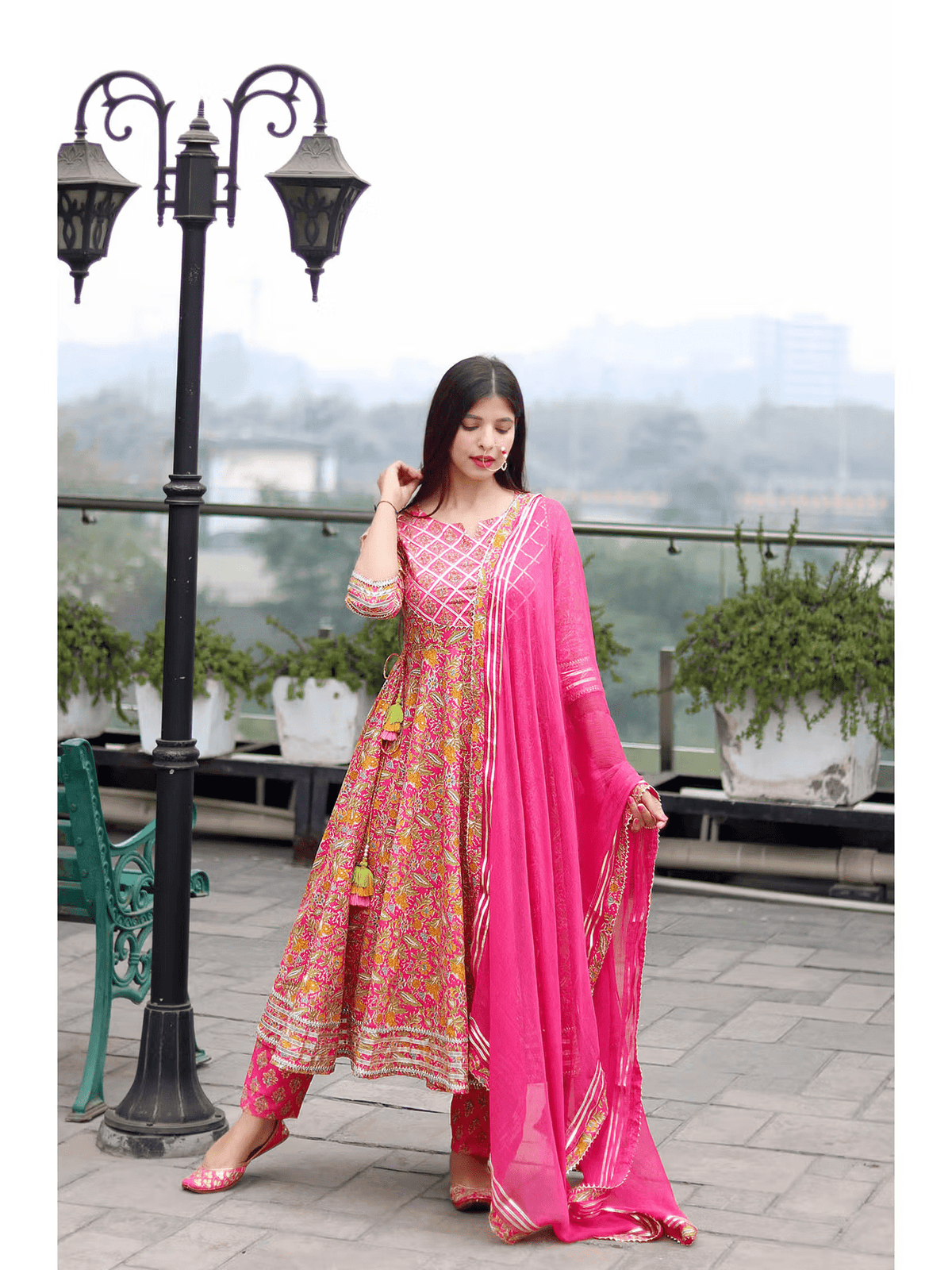 Floral Anarkali Kurta Set in vibrant pink with intricate patterns and matching dupatta