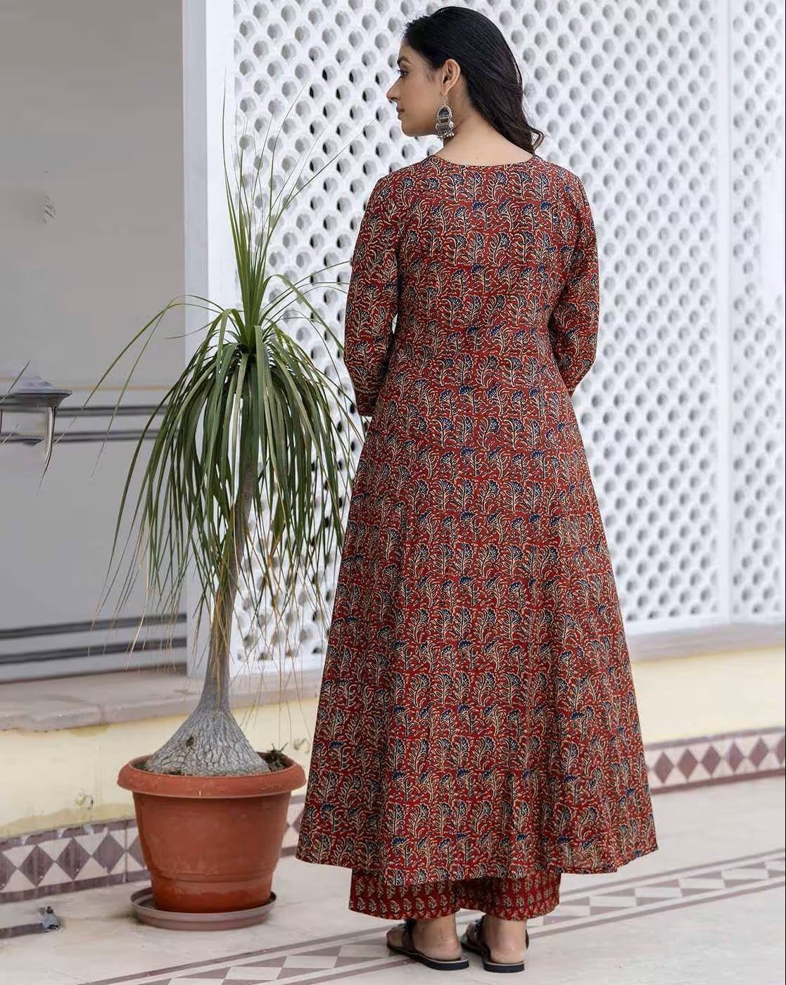 Elegant floral cotton kurta set with long sleeves and a flowing design in vibrant colors
