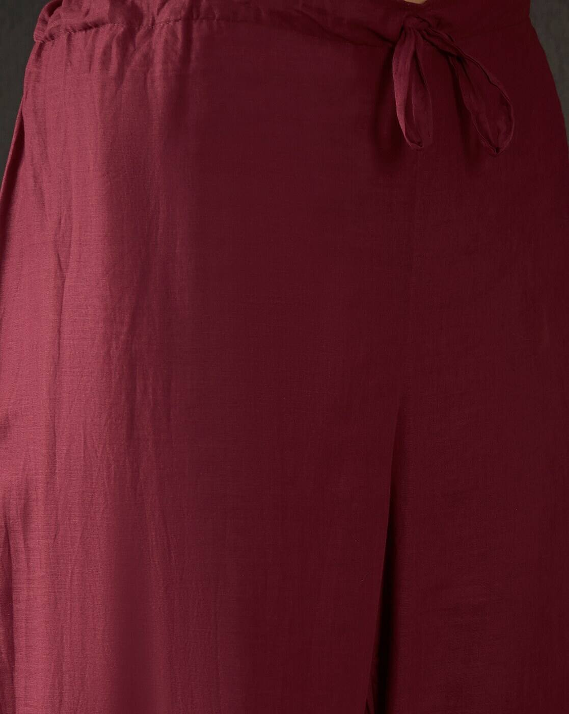 Close-up of maroon pants from aromie's floral embroidered cotton kurta set with drawstring waist
