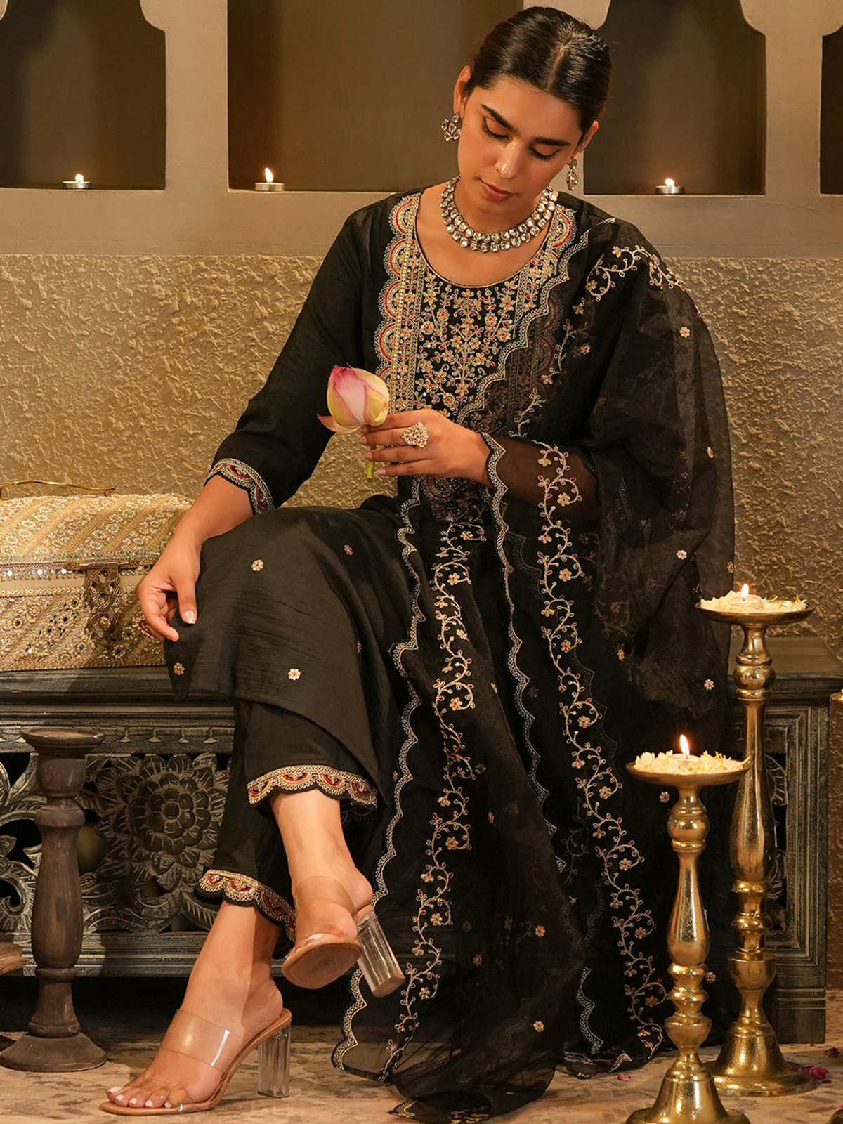 Elegant black floral embroidered kurta set with intricate designs and matching dupatta for festive occasions