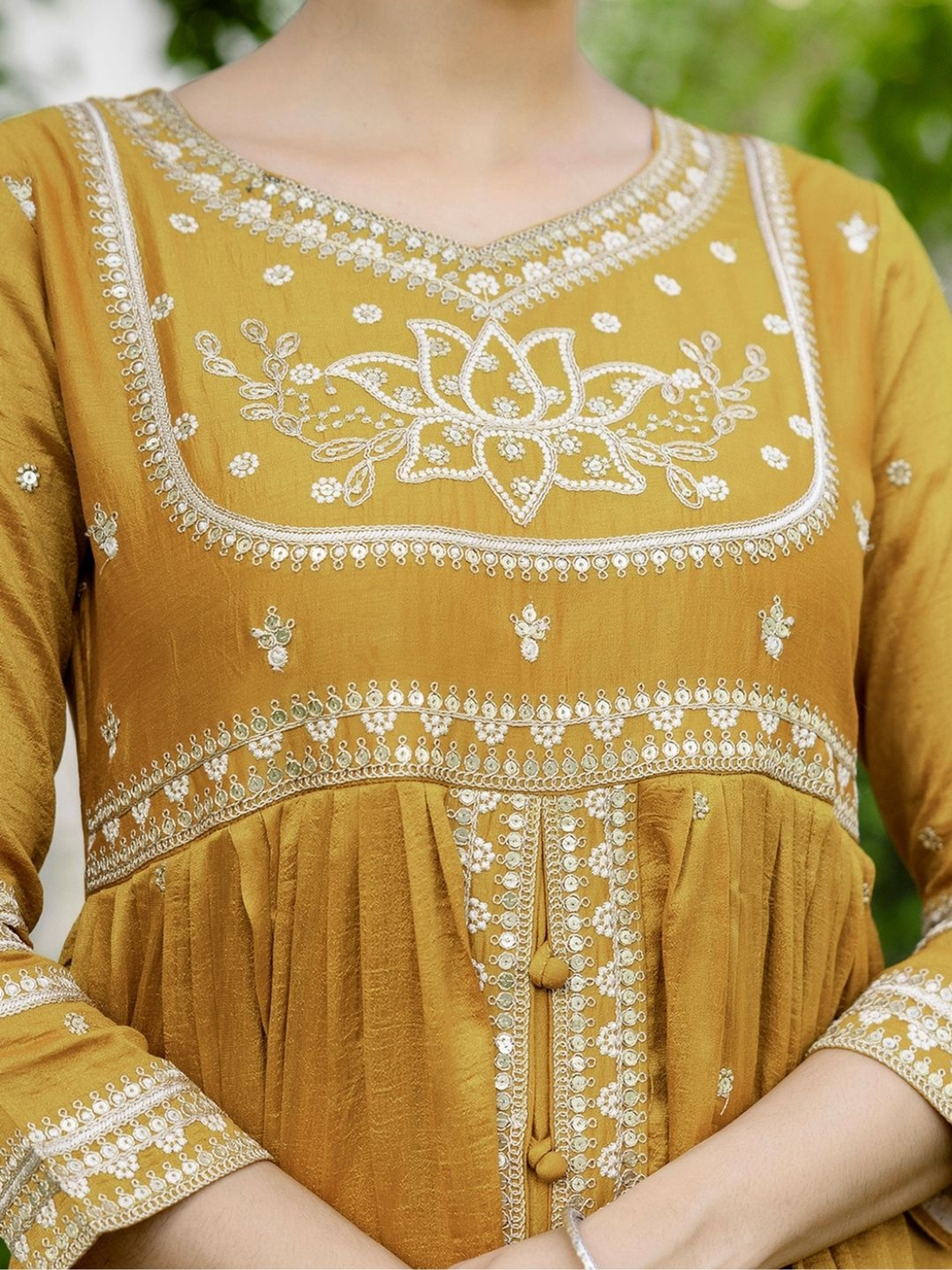 Floral embroidered kurta sharara set in mustard with intricate white embroidery and button details