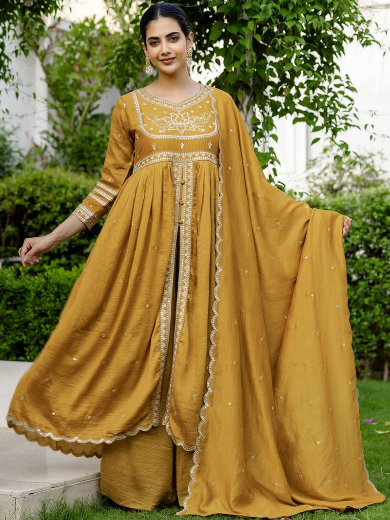 Floral embroidered kurta sharara set in mustard yellow with intricate detailing and elegant design