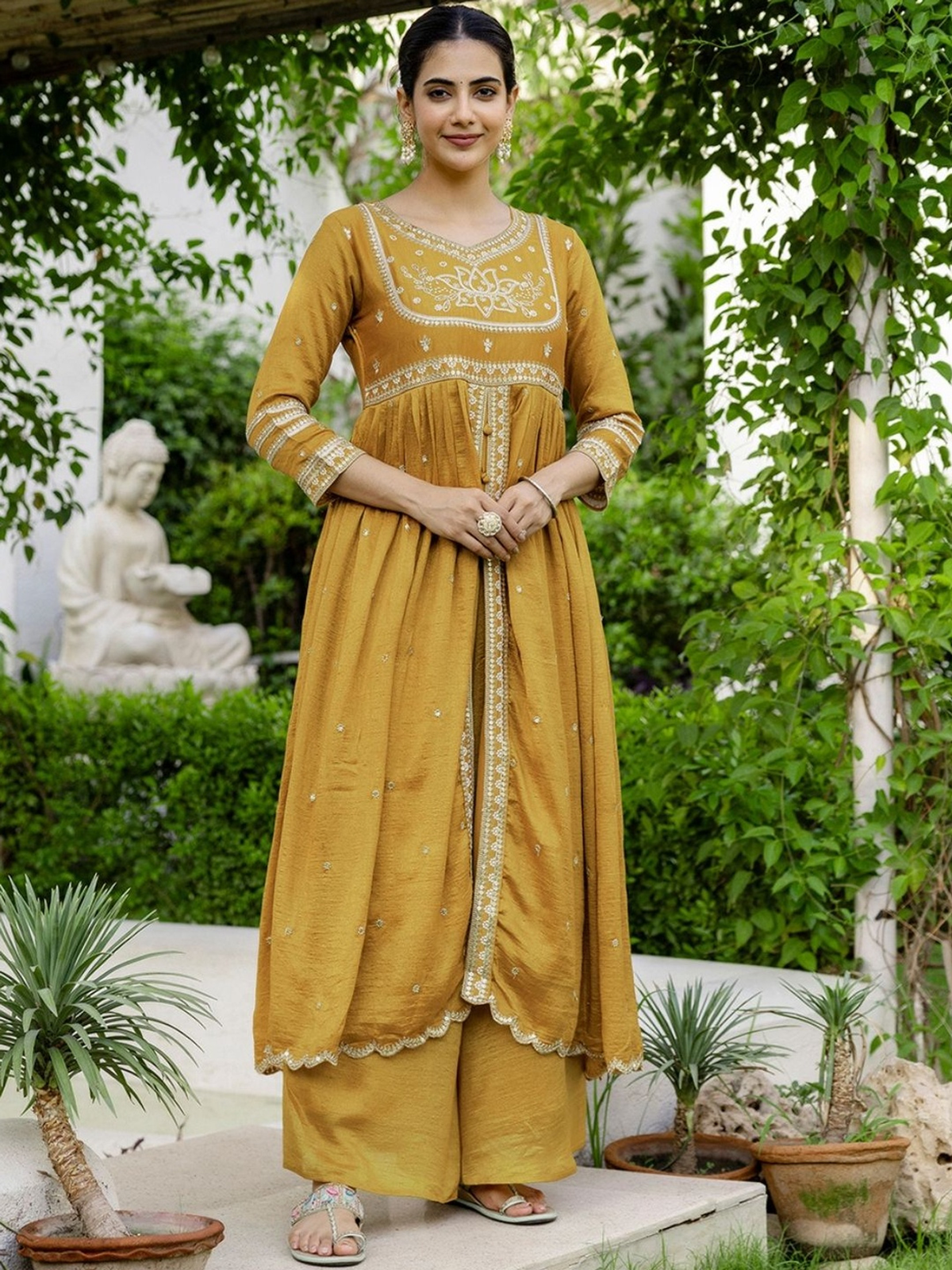 Aromie floral embroidered kurta sharara set in mustard color with intricate detailing and elegant design