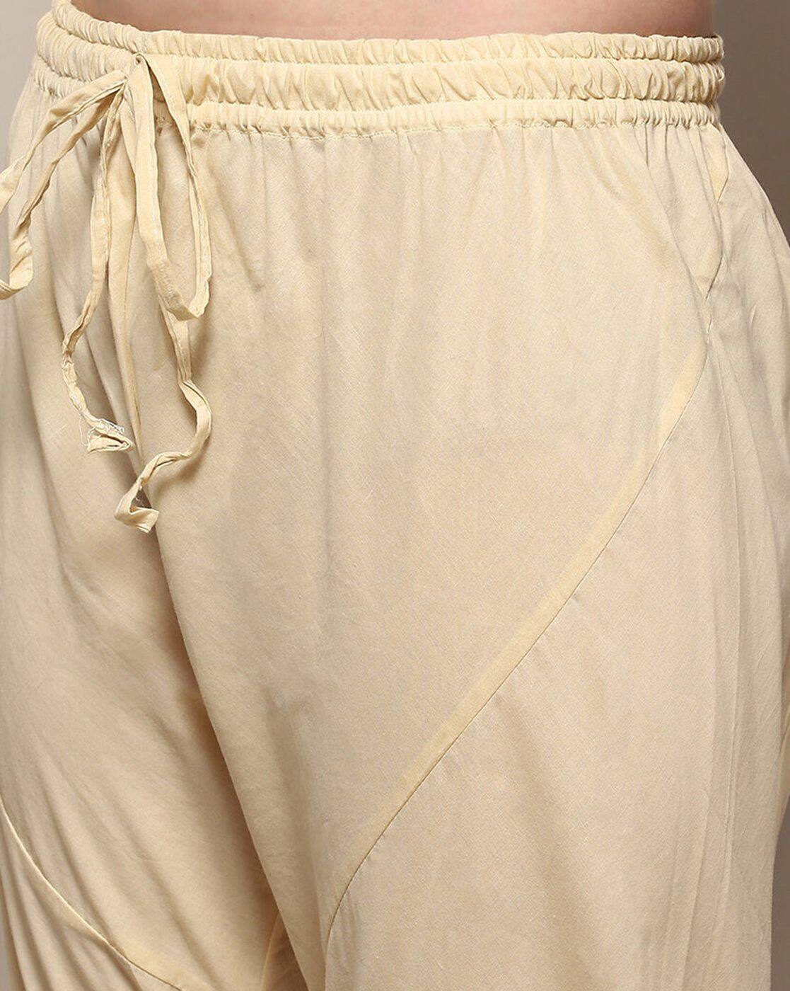 Close-up of cream color pants from aromie three piece kurtha with drawstring waist detail