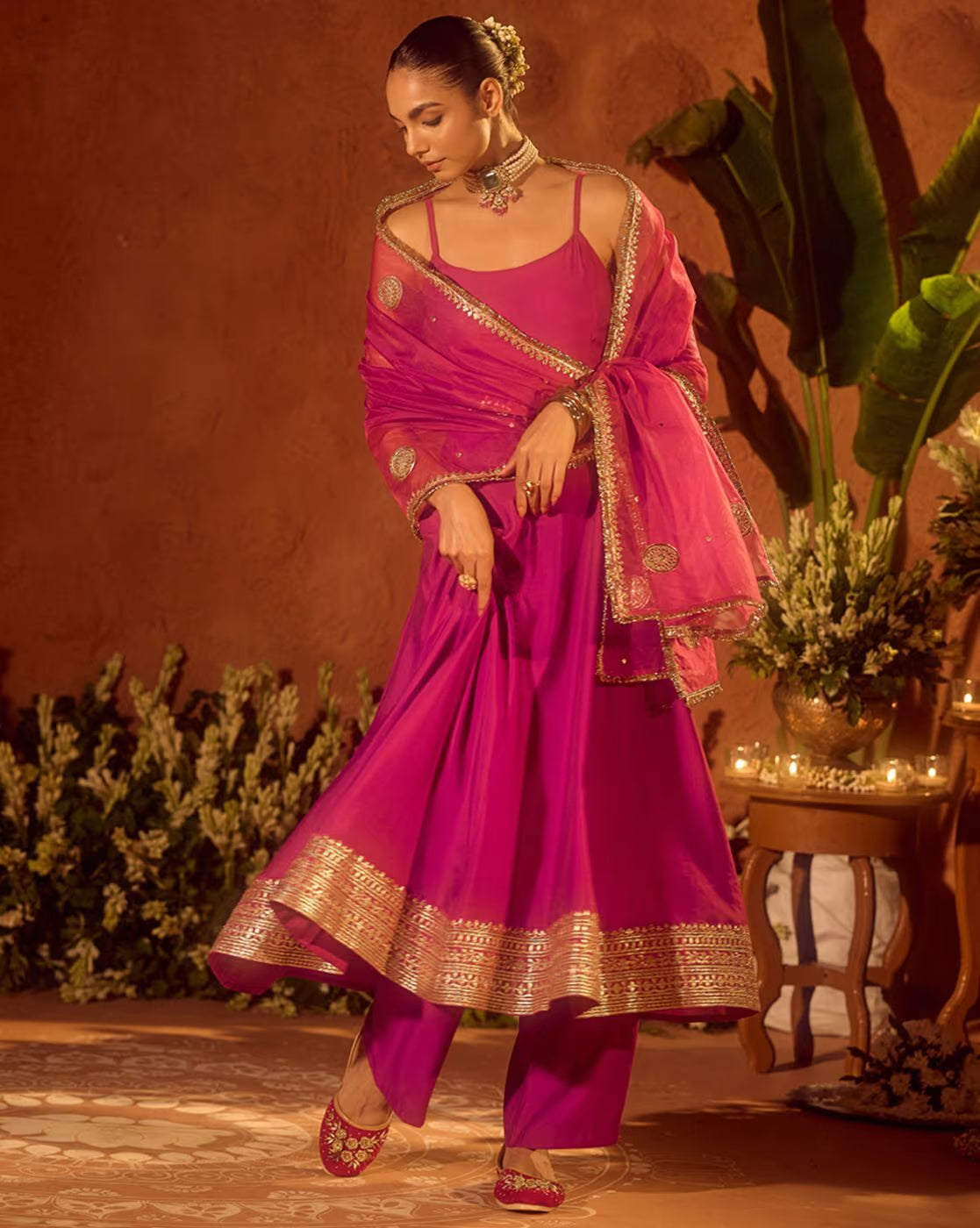 Elegant Floral Kurta Set for Women in vibrant pink with intricate gold detailing and matching dupatta