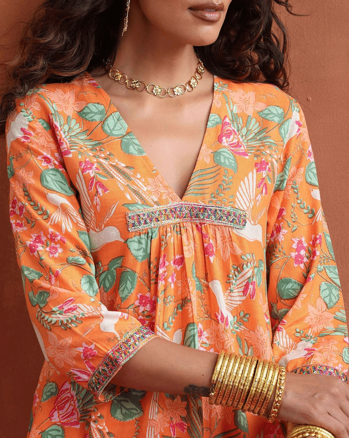 Aromie Floral Kurta Set for Women in vibrant orange with floral patterns and elegant detailing