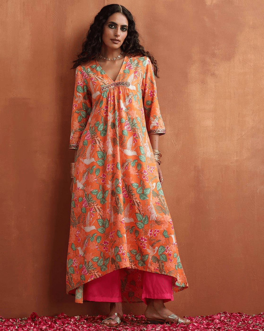 Aromie Floral Kurta Set for Women in Orange with Colorful Floral Patterns and a High-Low Hem