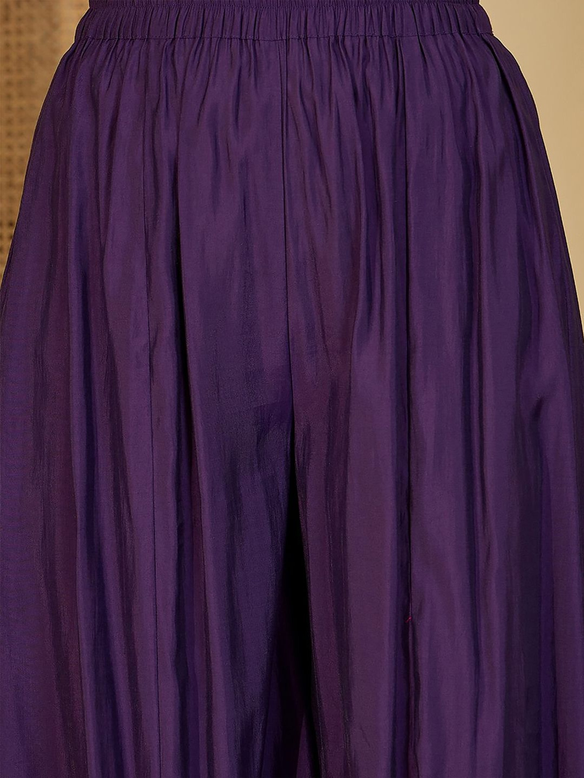 Elegant purple fabric featuring flowy design for a three piece floral printed bell sleeves kurta