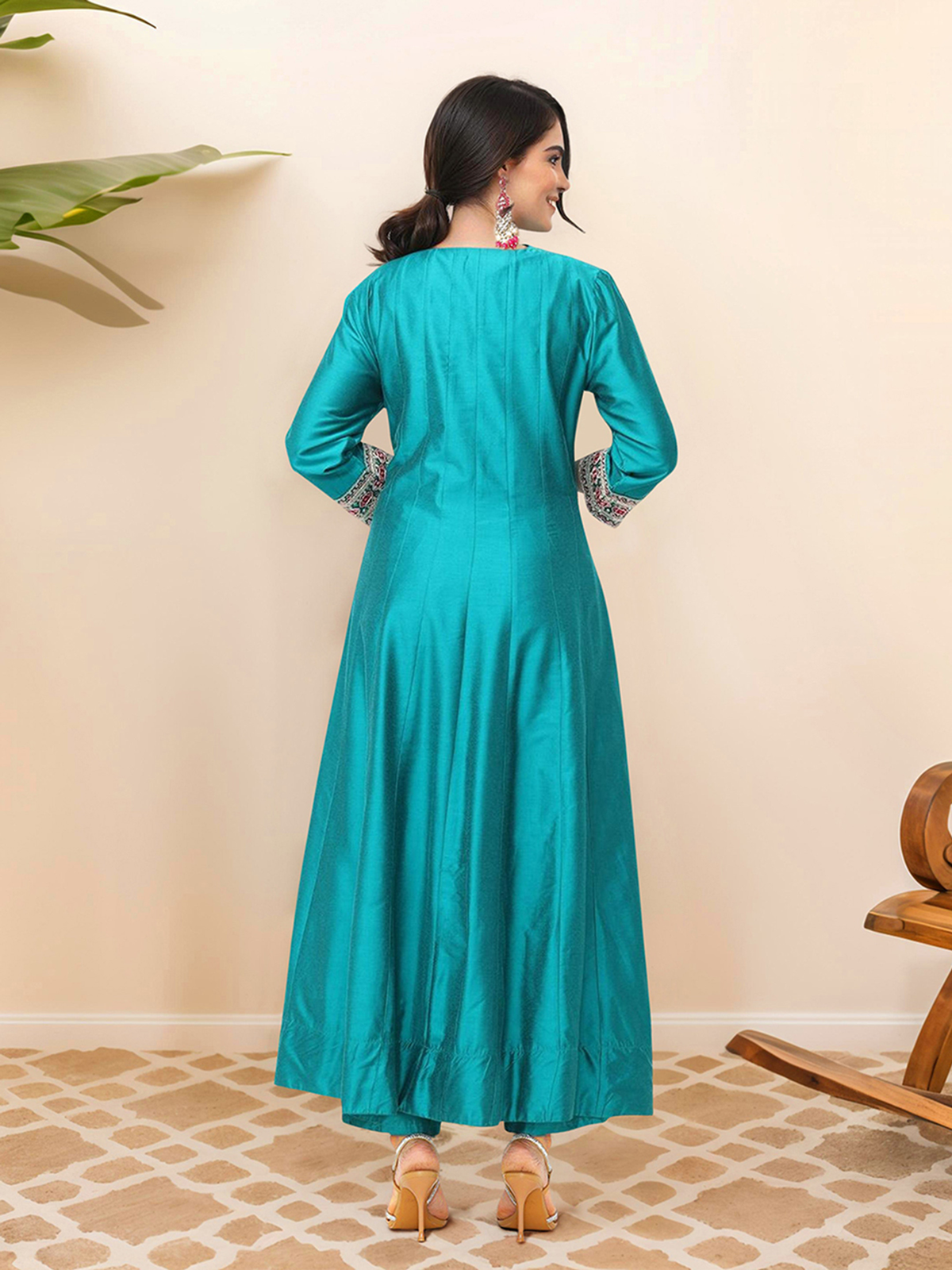Back view of a floral printed kurta Canada in teal with intricate detailing on the sleeves