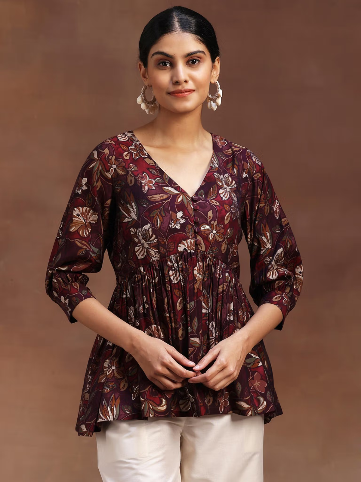 Aromie single piece kurta featuring a floral rayon jumpsuit pattern with three-quarter sleeves and V-neck